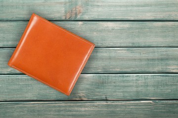 Leather wallet on wood desk