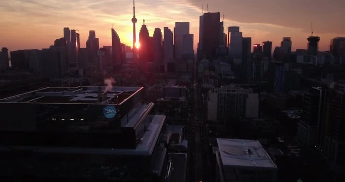 Drone aerial over downtown Toronto at sunset 