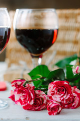 Flowers and glasses of wine on celebration of Valentine's day