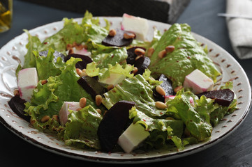 salad with beets, lettuce, feta cheese, roasted pine nuts and balsamic vinegar
