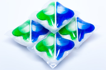 Colorful washing capsules for dishwasher on white background