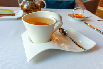 hot herbal tea in a white Cup