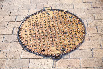 The iron manhole brown color.