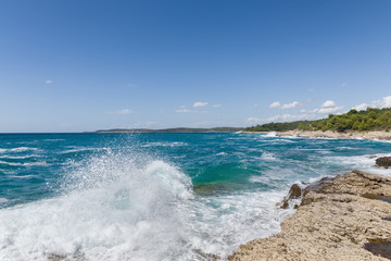 Fototapeta na wymiar Rocky shore of the Adriatic sea after storm