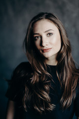 Fototapeta premium The secret of healse. Closeup portrait elegant handsome amazing woman. Long brown hair. Happy emotion. Top photo of spring. Daylight