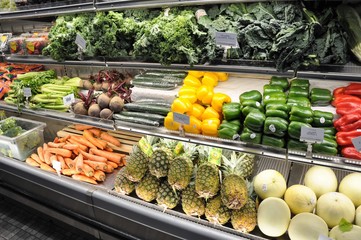  Vegetables and fruit. A variety of multi-colored fruits on shelves is pleasing to the eye.