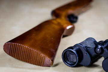 Shooting accessories on a wooden table in a shooting range. Shield and projectiles for pneumatic...