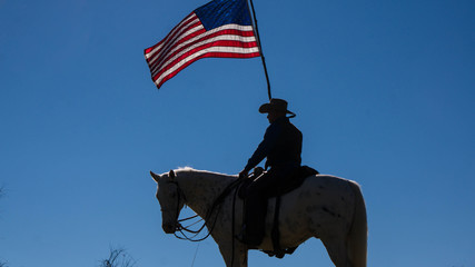 Man on horse for Veteran's Day - Powered by Adobe
