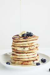 blueberry pancakes on white background