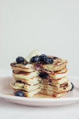 blueberry pancakes on white background