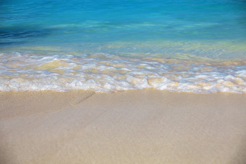 Fototapeta na wymiar sea surf, blue clear water and white sand