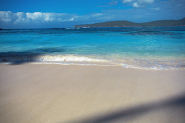 Fototapeta na wymiar beach with perfect white sand and blue clear water