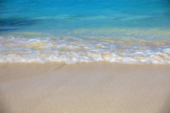 sea surf, blue clear water and white sand