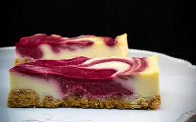 PIECES OF DELICIOUS HOMEMADE CHEESECAKE WITH WINTER FOREST FRUITS
