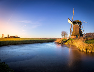 Fototapeta premium Windmill de Meervogel at winter afternoon