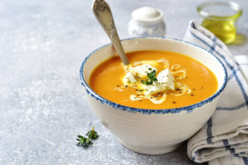 Thick pumpkin soup with feta cheese and thyme. - obrazy, fototapety, plakaty
