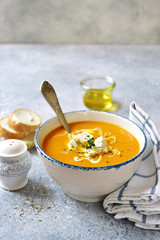 Thick pumpkin soup with feta cheese and thyme.