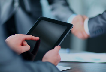 Businessman holding digital tablet.