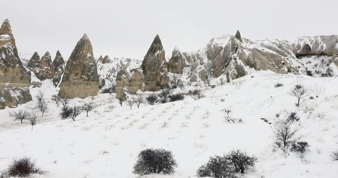 Valley of love covered by snow at winter time Cappadocia. Turkey
