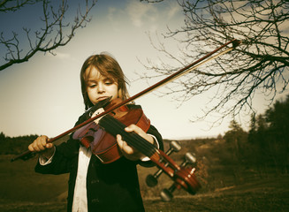 boy playing violin, happy and smiling, success and happiness © Amir Bajric