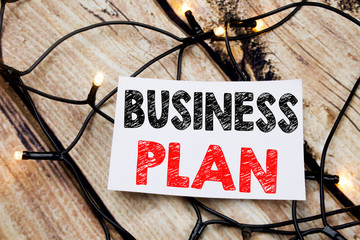 Handwritten text caption showing Business Plan Planning. Business concept writing for Preparation Project Strategy written on sticky note paper on the wooden background.