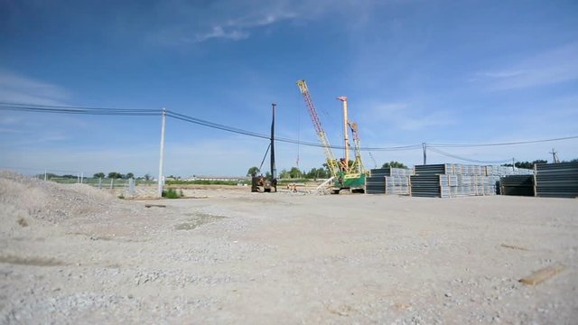 Panoramic view on the construction site. Just a construction site in the summer without people.