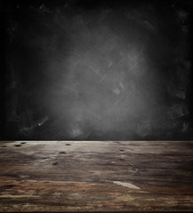Table and chalkboard wall