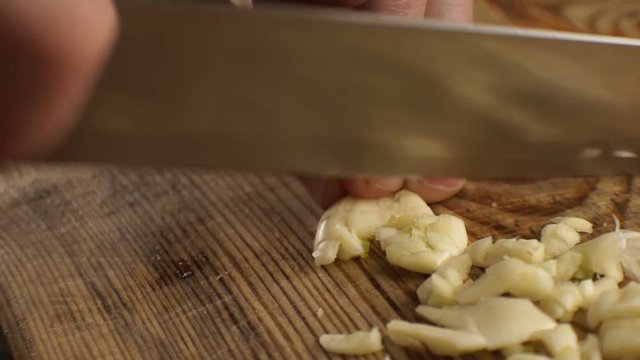 Sliced garlic for sauce side view. Video