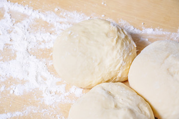 Fototapeta na wymiar Raw wheat yeast dough on the table