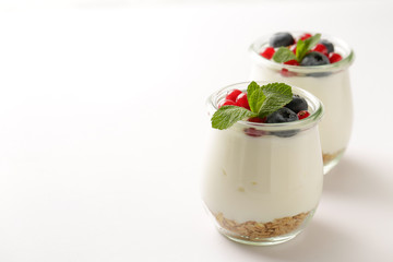 Homemade yogurt with granola and fresh berries, selective focus. Healthy breakfast ingredient