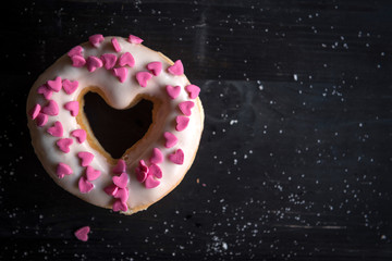 Heart shape donut on the dark background,selective focus and blank space