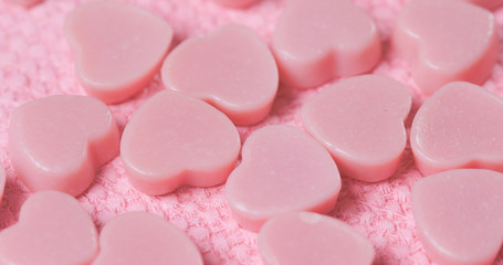 Chocolate candy on pink background