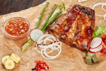 Grilled pork ribs, sweet and sour sauce. Meat with vegetables