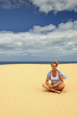 Fototapeta na wymiar Girl on the beach, Corralejo, Fuerteventura, Canary Islands