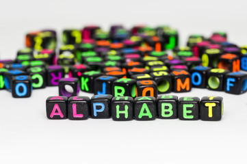 Fototapeta premium Colorful plastic beads with letters.conceptual image