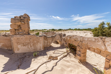 Ruins of the remote and isolated historic Eucla Telegraph Station overun by shifting sands at Eucla...