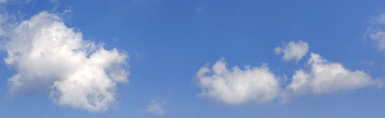 Fototapeta premium Panorama view of white clouds in blue sky for background