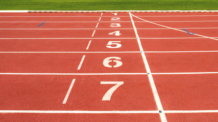 red running track on athletic stadium background texture