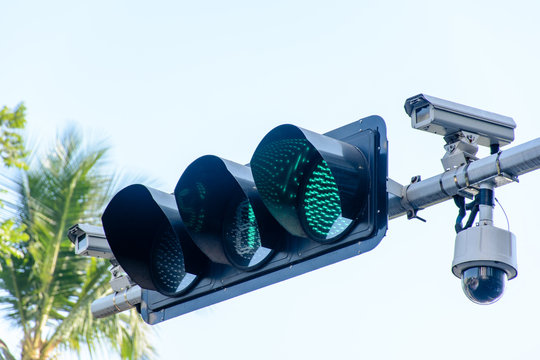 photo of traffic light and cctv camera