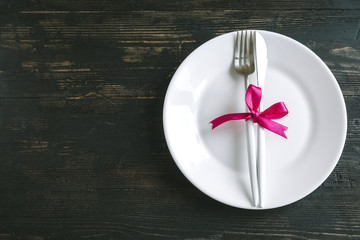 Table setting with red ribbon