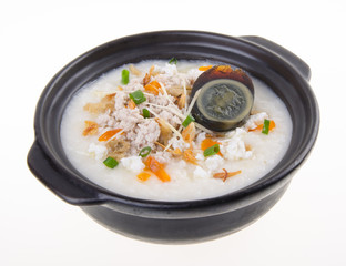 Traditional chinese century egg & pork porridge rice gruel served in claypot