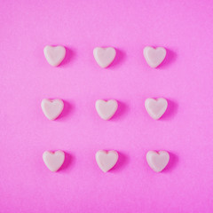 valentine candy hearts shape on pink background