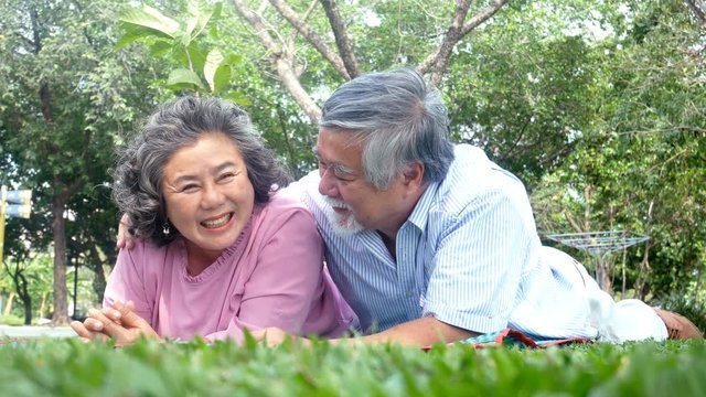 Asian couple elder people relax at park together. People lifestyle concept 