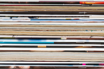 A stack of old magazines. Closeup