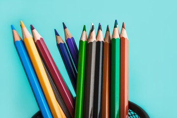 colored pencils on pastel background