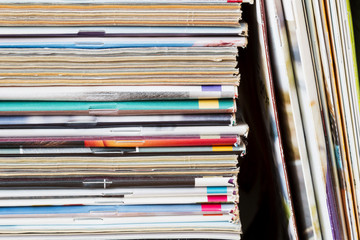 A stack of old magazines. Closeup