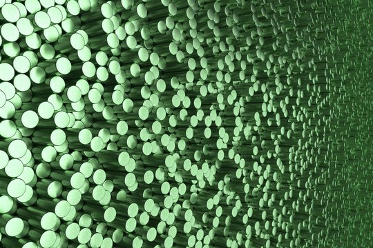 Pattern of green brushed metal cylinders of different length