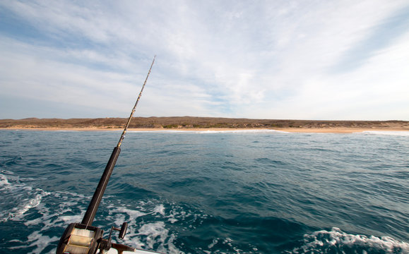 View of fishing rod on charter fishing boat on the Pacific side of Cabo San Lucas in Baja California Mexico BCS