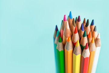 the tip of the colored pencils on pastel background