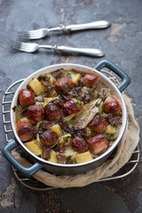 Bowl with Dublin coddle or traditional Irish potato, sausage, bacon and onion stew, selective focus, vertical shot